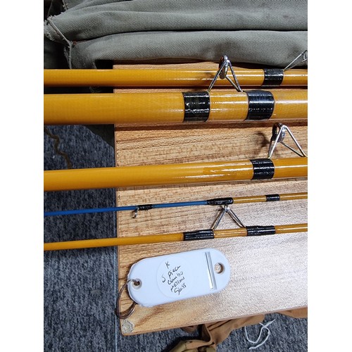 9 - A collection of 3x good fishing rods to include a K five piece combo hollowed glass rods set, a 3 pi... 