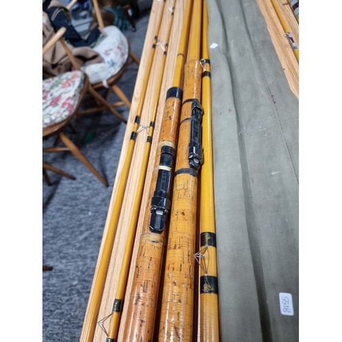 9 - A collection of 3x good fishing rods to include a K five piece combo hollowed glass rods set, a 3 pi... 