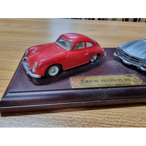 16 - A Dinky 3x model diecast sports car set all attached to a presentation plinth to include a Ferrari D... 