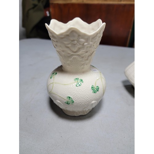 136 - 3x Belleek pieces inc a clock, owl figurine, and vase. Clock requires a new face, largest piece meas... 