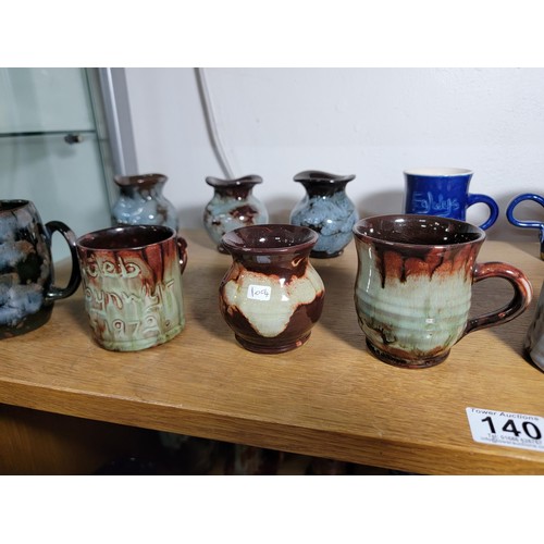 140 - 13x Ewenny Ware studio pottery pieces inc tankards and vases all of different colours inc a royal co... 