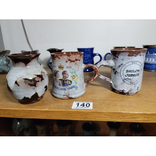 140 - 13x Ewenny Ware studio pottery pieces inc tankards and vases all of different colours inc a royal co... 