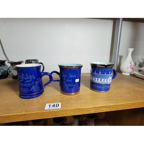 140 - 13x Ewenny Ware studio pottery pieces inc tankards and vases all of different colours inc a royal co... 