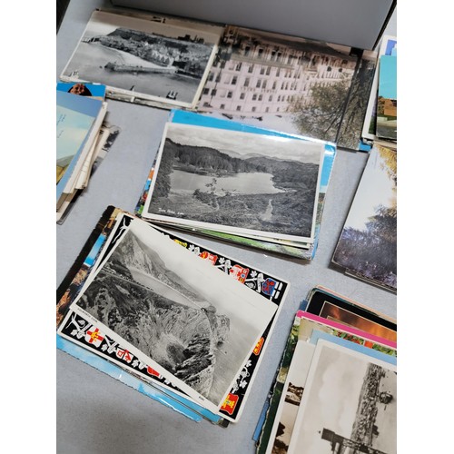 153 - 2x boxes containing a very large collection of postcards from around the world inc Malta, California... 