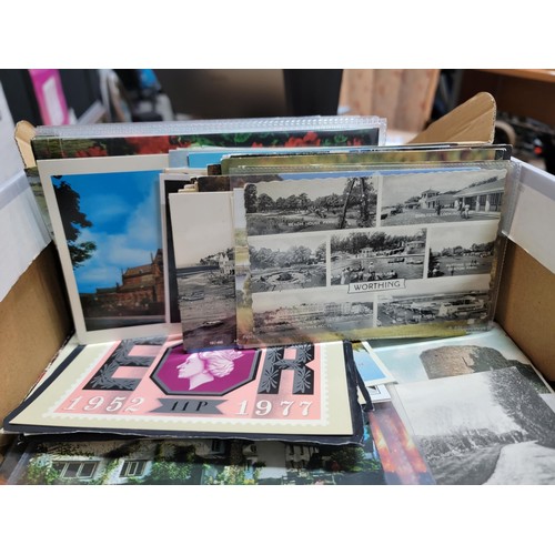 153 - 2x boxes containing a very large collection of postcards from around the world inc Malta, California... 