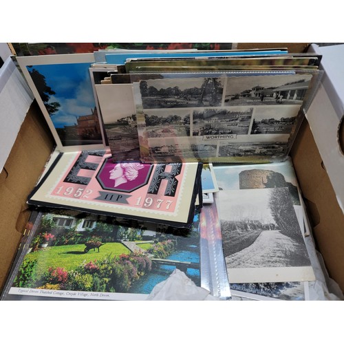 153 - 2x boxes containing a very large collection of postcards from around the world inc Malta, California... 