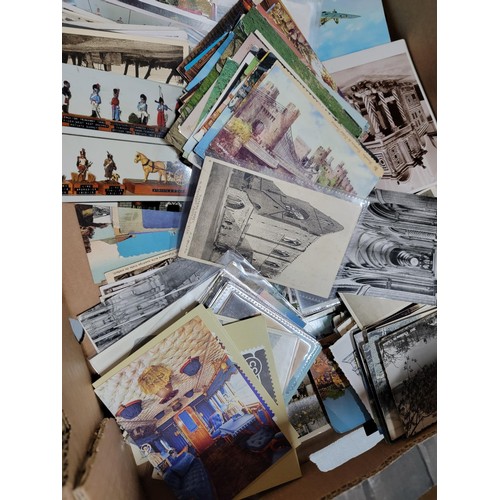 153 - 2x boxes containing a very large collection of postcards from around the world inc Malta, California... 