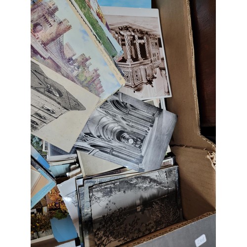 153 - 2x boxes containing a very large collection of postcards from around the world inc Malta, California... 