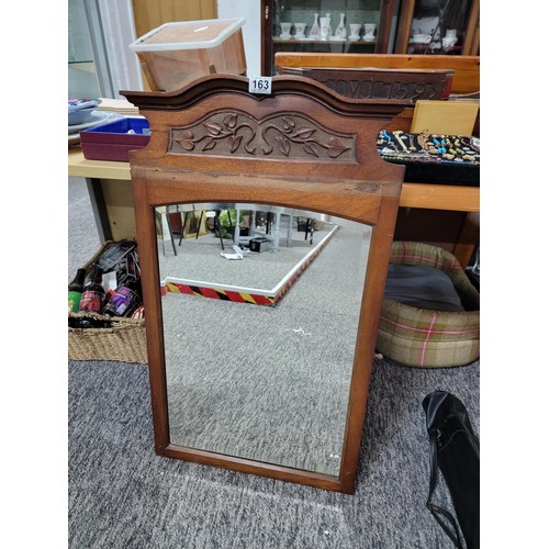 163 - Good quality wooden framed bevel edged mirror with ivy design to the top, removed from a dressing ta... 