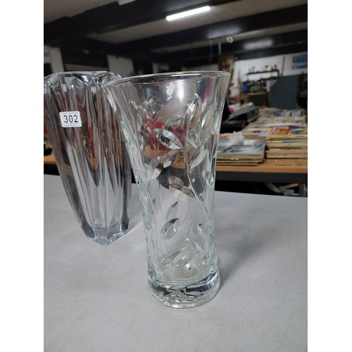 302 - 2 large decorative lead crystal flower vases inc a leaf design, tallest vase stands at 33cm high