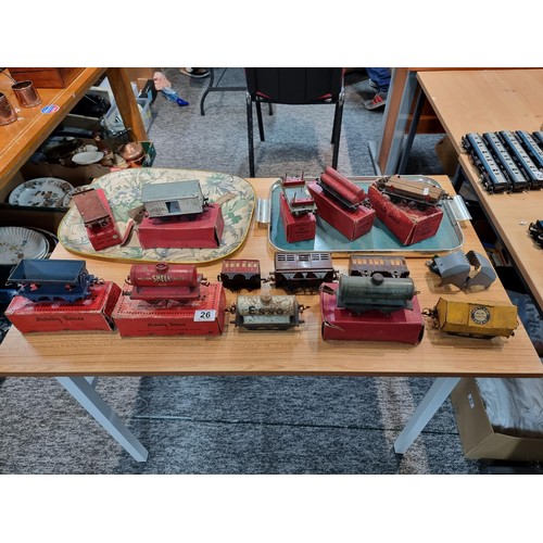 26 - A large collection of O gauge model railway accessories to include a large quantity of advertising r... 