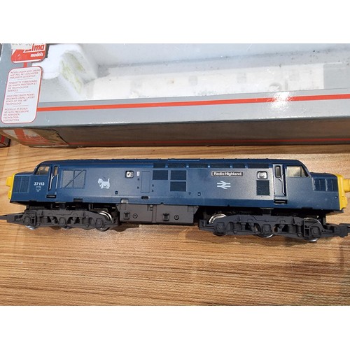 28 - 2x boxed diesel locomotives OO gauge, one which is by Hornby 37113 (Radio Highland) the other by Lim... 