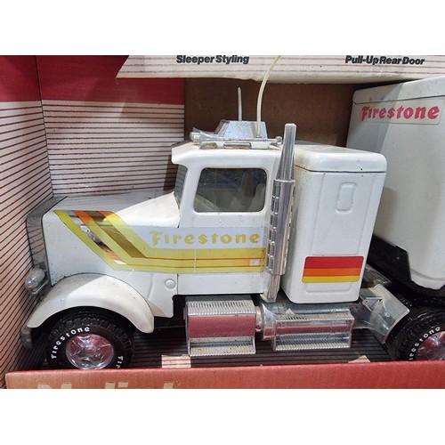 34 - A boxed unused Nylint Silver Knight NO.345 large scale steel model 18 wheeler truck with firestone a... 