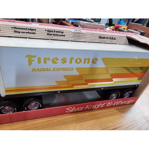 34 - A boxed unused Nylint Silver Knight NO.345 large scale steel model 18 wheeler truck with firestone a... 