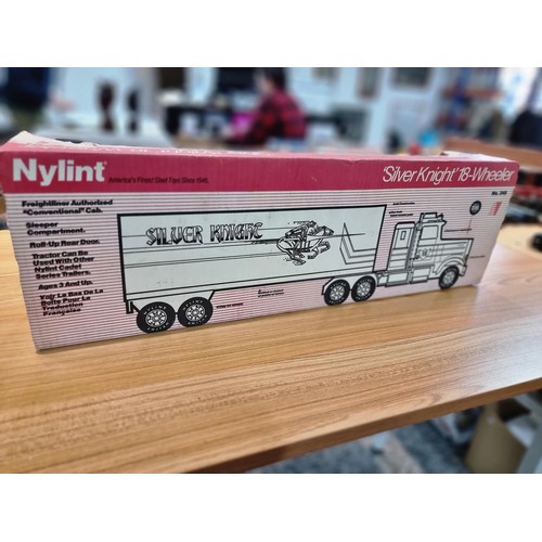 34 - A boxed unused Nylint Silver Knight NO.345 large scale steel model 18 wheeler truck with firestone a... 