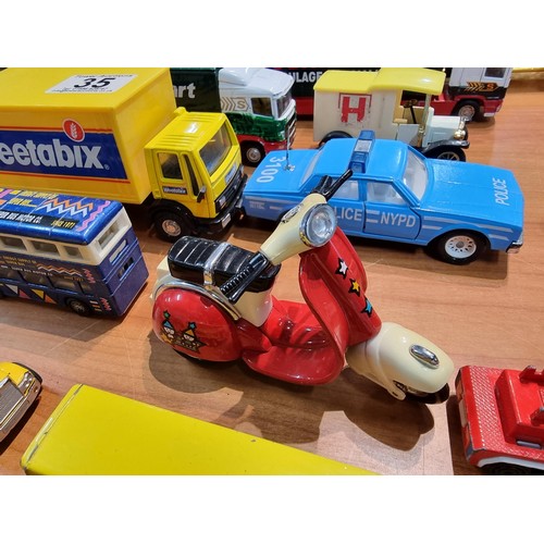 35 - A collection of 15x diecast model vehicles to include 2x Corgi Eddie Stobart lorries, a diecast scoo... 