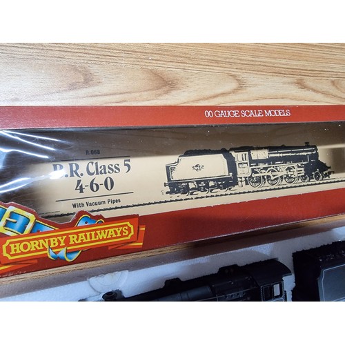 48 - A boxed as new Hornby R068 BR class 5, 4-6-0 locomotive and tender. Boxed in like new condition and ... 