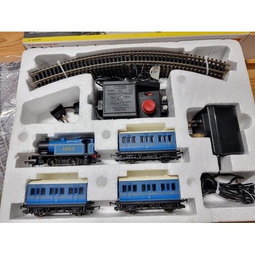 52 - A boxed Hornby R1016 Caledonian local train set, complete. Includes locomotive, 3 matching coaches a... 