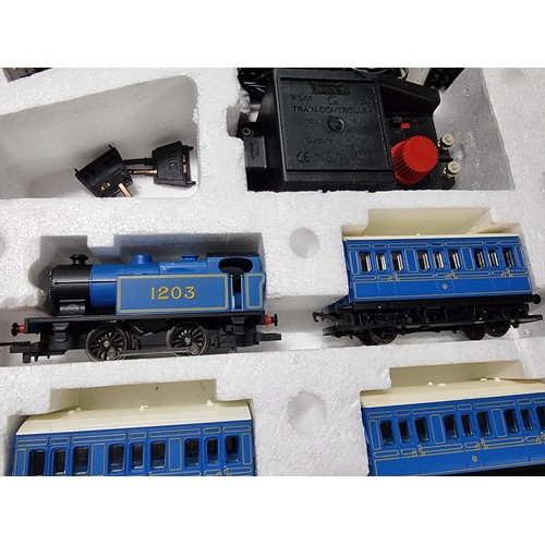 52 - A boxed Hornby R1016 Caledonian local train set, complete. Includes locomotive, 3 matching coaches a... 