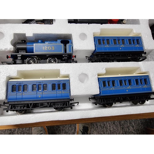 52 - A boxed Hornby R1016 Caledonian local train set, complete. Includes locomotive, 3 matching coaches a... 