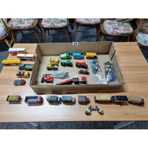 58 - A box full of various diecast and plastic model vehicles many relating to model railway trackside to... 