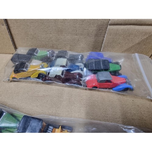 58 - A box full of various diecast and plastic model vehicles many relating to model railway trackside to... 