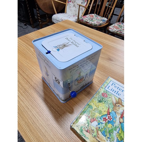 59 - A collection of Peter Rabbit items to include a Peter Rabbit tin Jack in a box by Rainbow designs al... 