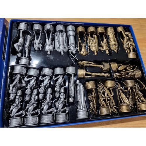 63 - A Star Wars Episode II Attack of the Clones pewter and bronze effect chess set, complete with many c... 