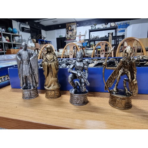 63 - A Star Wars Episode II Attack of the Clones pewter and bronze effect chess set, complete with many c... 