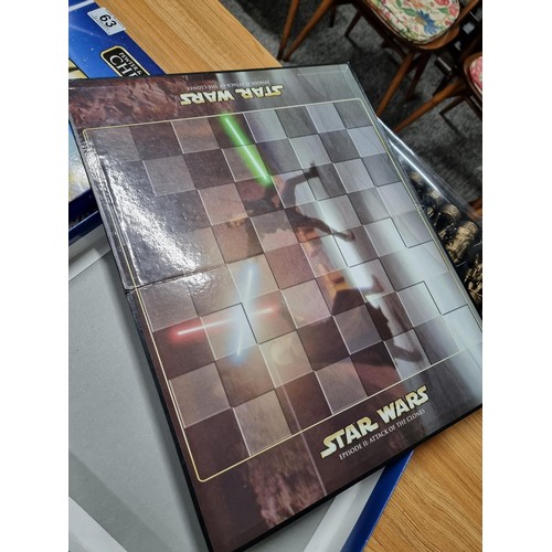 63 - A Star Wars Episode II Attack of the Clones pewter and bronze effect chess set, complete with many c... 