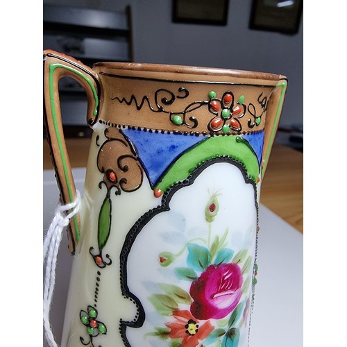 174 - A very pretty quality hand painted twin handled vase by Noritake Japan featuring a hand painted flor... 