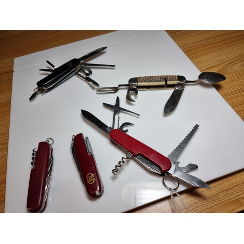 177 - A quantity of 5 multi tool knives in the style of Swiss army by various makers to include a Stag isl... 