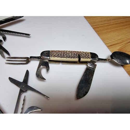 177 - A quantity of 5 multi tool knives in the style of Swiss army by various makers to include a Stag isl... 