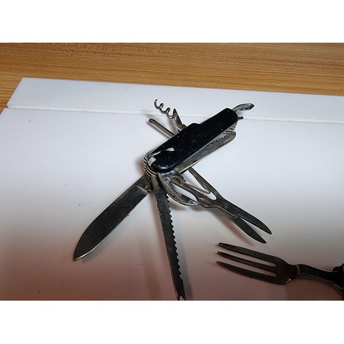 177 - A quantity of 5 multi tool knives in the style of Swiss army by various makers to include a Stag isl... 