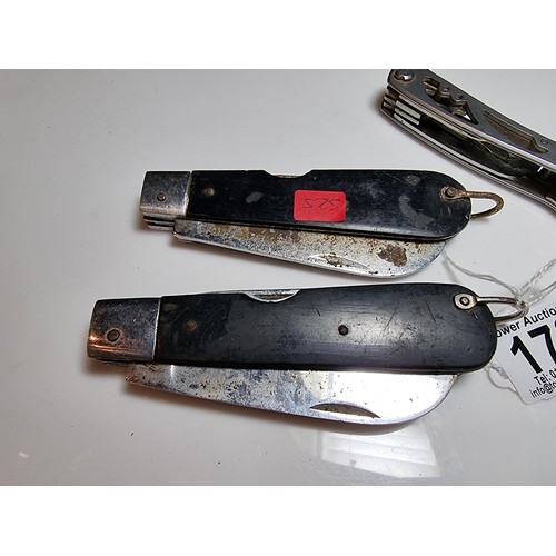 178 - 2 large folding knives along with a multi tool knife featuring pliers, saws, screwdrivers, etc. The ... 