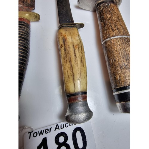 180 - 3 good vintage hunting knives to include a small William Rogers knife, a small antler handled knife ... 