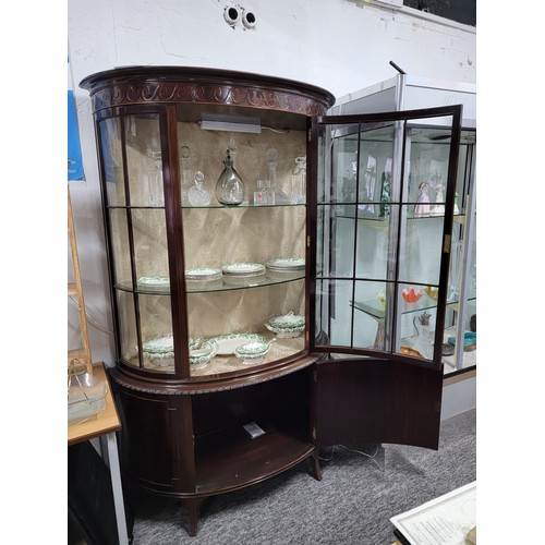 312 - Good quality mahogany bow fronted glazed display cabinet, illuminated, swirl carving top, 3 shelves ... 