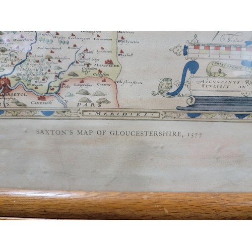 318 - A good oak framed and glazed vintage reproduction Saxton's map of Gloucestershire 1577.