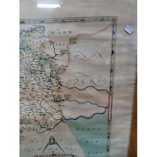 318 - A good oak framed and glazed vintage reproduction Saxton's map of Gloucestershire 1577.