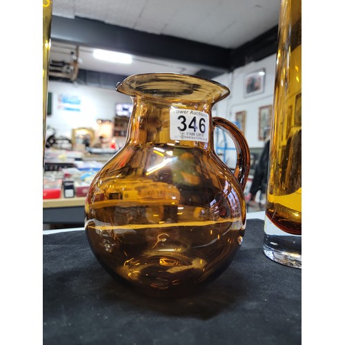 346 - 3x amber glass coloured pieces of glassware inc a large glass pitcher jug and 2x tall tube like vase... 