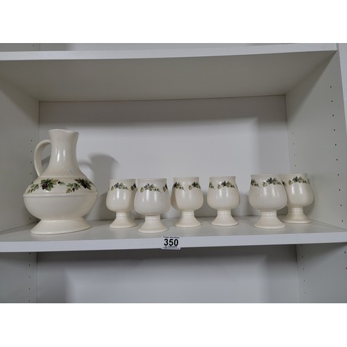 350 - Good quality set of Prinknash pottery inc handled jug and 6x goblets with floral design, jug stands ... 