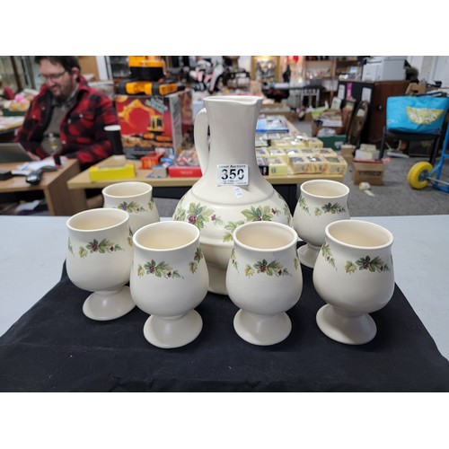 350 - Good quality set of Prinknash pottery inc handled jug and 6x goblets with floral design, jug stands ... 