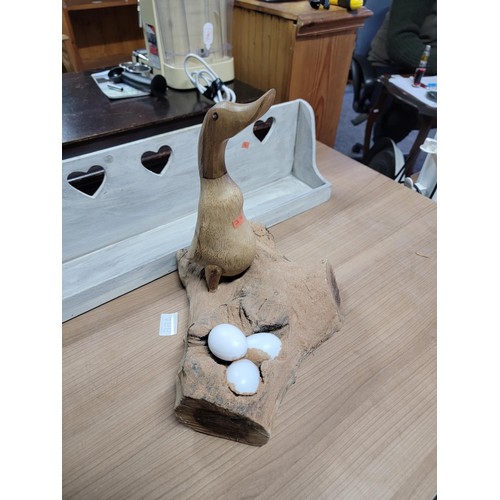 426 - Wooden fair trade duck on a log with egg decoration along with a heart decorated shelf