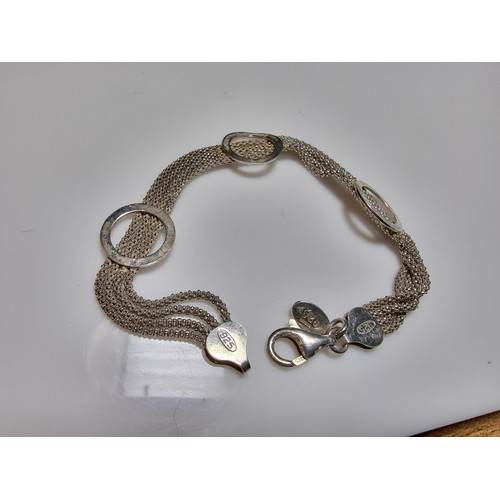 189 - A 925 silver Italy 4 strand bracelet by Laura Ashley, in excellent clean condition, boxed, length of... 