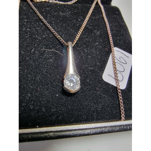 191 - A 925 silver pendant inset with a sparkly CZ stone on an 18