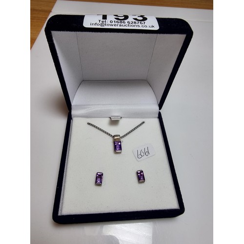 193 - A 925 silver matching jewellery set to include a 925 silver pendant inset with an amethyst stone on ... 