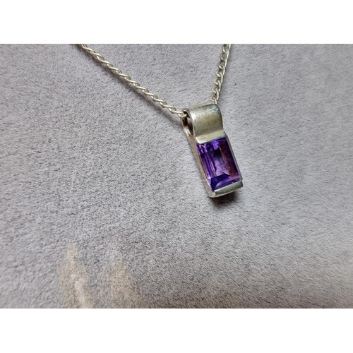 193 - A 925 silver matching jewellery set to include a 925 silver pendant inset with an amethyst stone on ... 