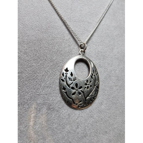 195 - A pretty 925 silver pierced pendant with a floral design fitted in its original box on an 18