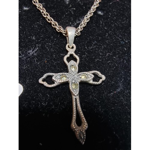 200 - A 925 silver cross pendant inset with Marcasite stones set on a good 18