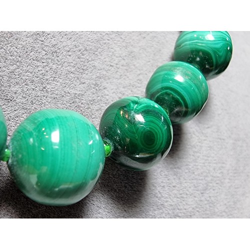 203 - An impressive Malachite beaded necklace with a graduating design, the malachite beads present an exc... 